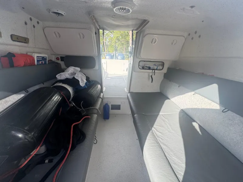 Slide: The Image of Interior of 2002 Protector 28 Targa boat with seating and equipment storage. - 10