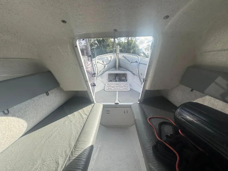 Slide: The Image of Interior view of 2002 Protector 28 Targa boat cabin with seating and hatch. - 7