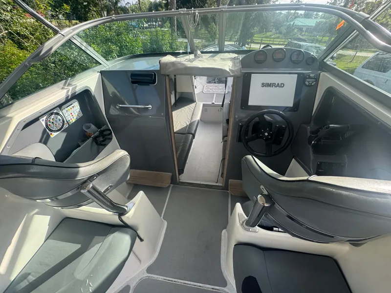 Slide: The Image of Interior of 2002 Protector 28 Targa boat with steering wheel and navigation equipment. - 8