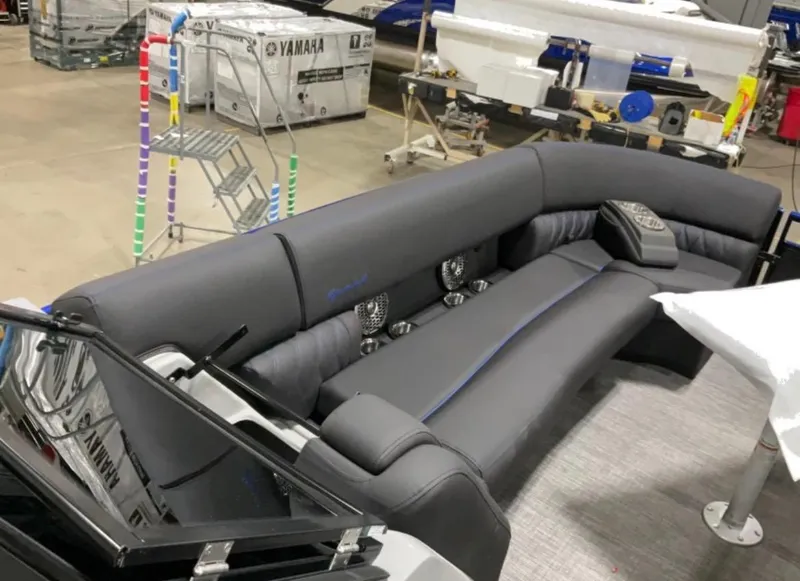 Slide: The Image of 2024 Bennington RX Sport Line boat interior with sleek gray seating and modern design. - 4