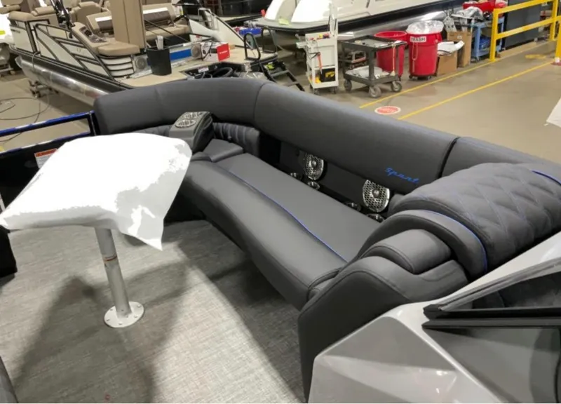 Slide: The Image of 2024 Bennington RX Sport Line boat interior with plush seating and modern design. - 5