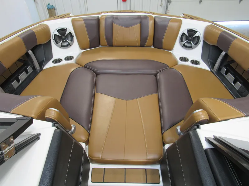 Slide: The Image of 2020 Malibu Wakesetter 23 MXZ interior with brown and tan leather seating. - 11