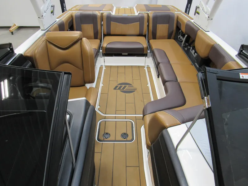 Slide: The Image of 2020 Malibu Wakesetter 23 MXZ interior with brown and tan seating. - 12