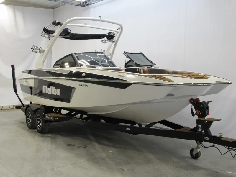 Slide: The Image of 2020 Malibu Wakesetter 23 MXZ boat on trailer in showroom. - 2