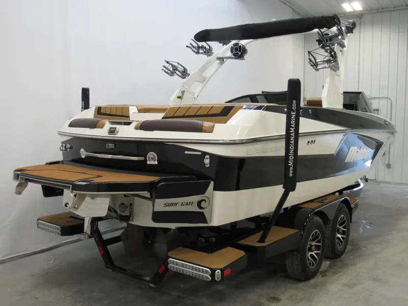 Slide: The Image of 2020 Malibu Wakesetter 23 MXZ boat on trailer in indoor storage. - 3