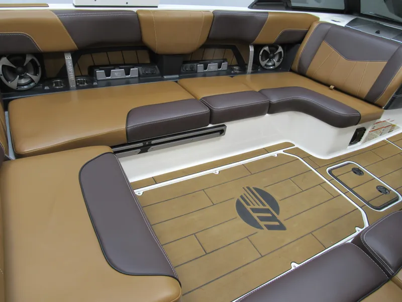 Slide: The Image of 2020 Malibu Wakesetter 23 MXZ interior with brown leather seating and stylish flooring. - 8