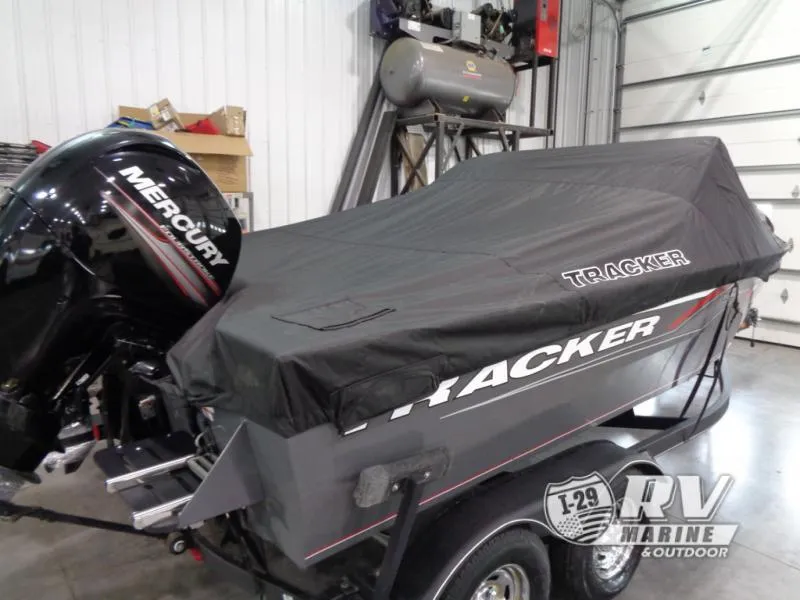 Slide: The Image of 2018 Targa V-18 WT boat with Mercury engine, covered in a garage. - 12