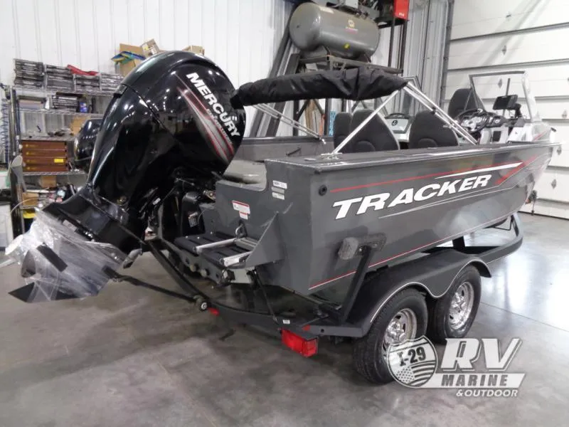 Slide: The Image of 2018 Targa V-18 WT boat with Mercury engine in a garage setting. - 14