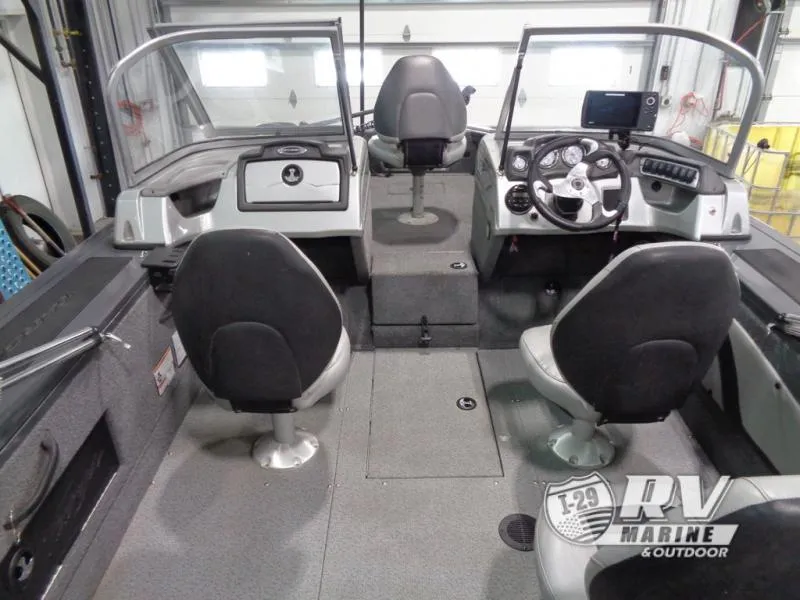 Slide: The Image of 2018 Targa V-18 WT boat interior with seating and control panel in showroom. - 15
