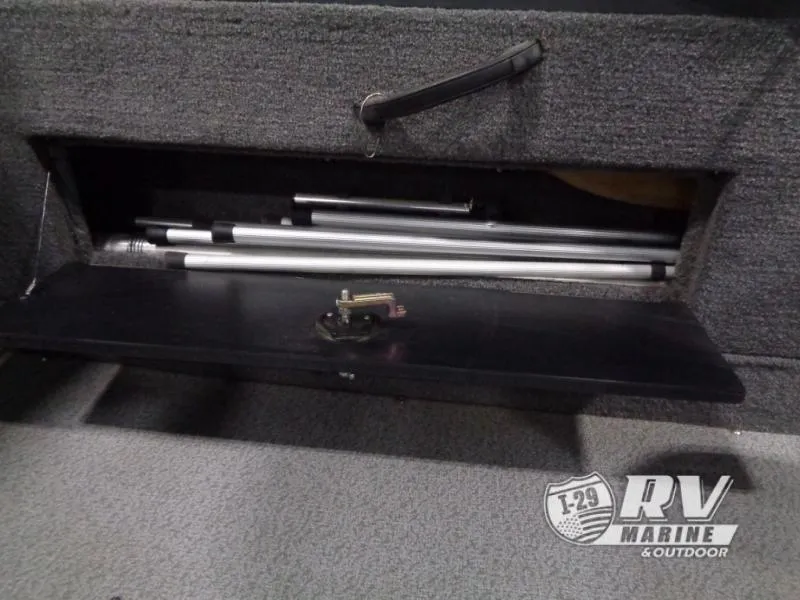 Slide: The Image of Storage compartment in 2018 Targa V-18 WT boat with aluminum poles. - 18