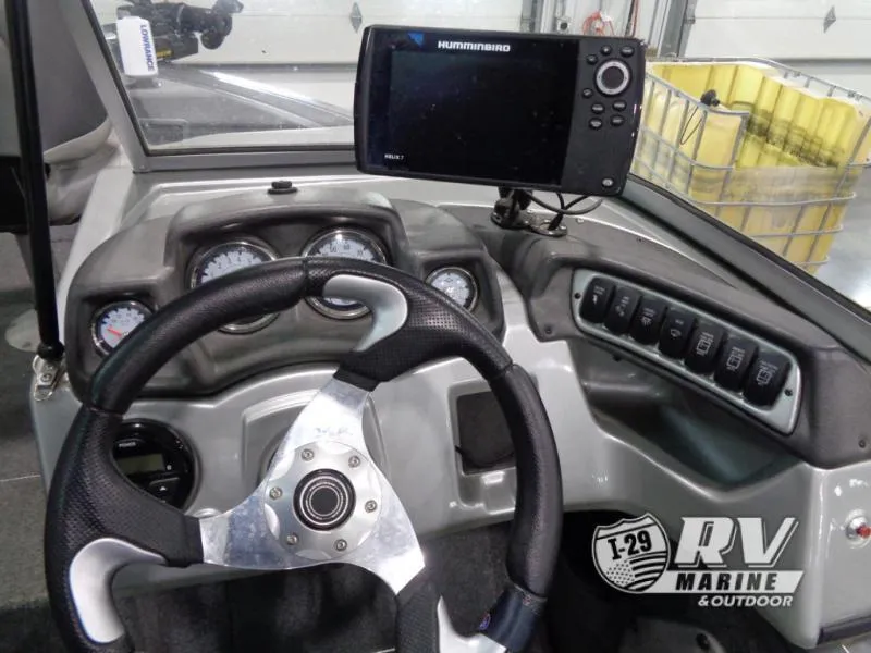 Slide: The Image of 2018 Targa V-18 WT boat dashboard with steering wheel and Humminbird fish finder. - 23