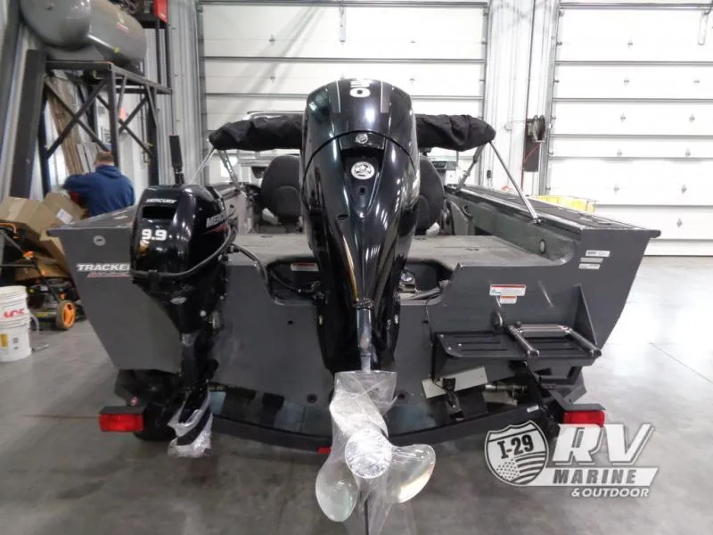 Slide: The Image of 2018 Targa V-18 WT boat with dual Mercury outboard motors in a garage setting. - 24