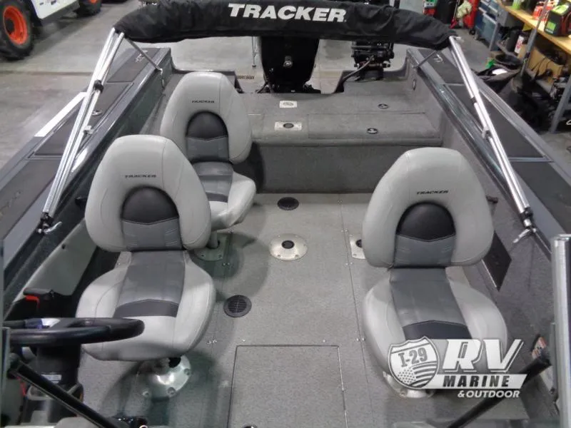 Slide: The Image of 2018 Targa V-18 WT boat interior with gray seating and steering wheel. - 26