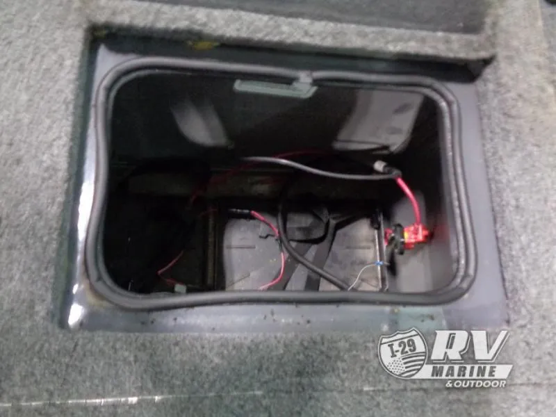 Slide: The Image of Open storage compartment in 2018 Targa V-18 WT boat with visible wiring. - 27