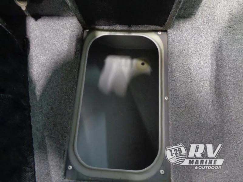 Slide: The Image of 2018 Targa V-18 WT boat storage compartment with carpeted interior. - 32