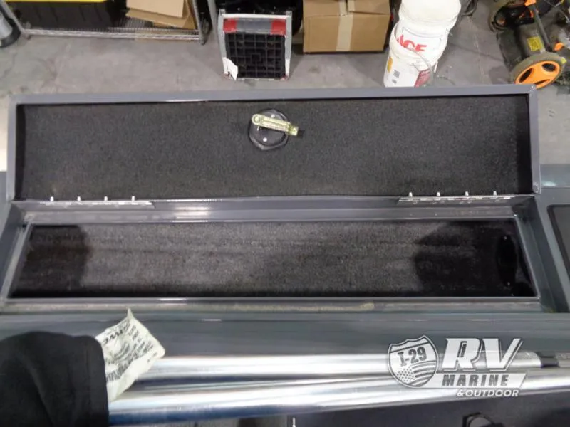 Slide: The Image of Open storage compartment of 2018 Targa V-18 WT boat in a workshop setting. - 6
