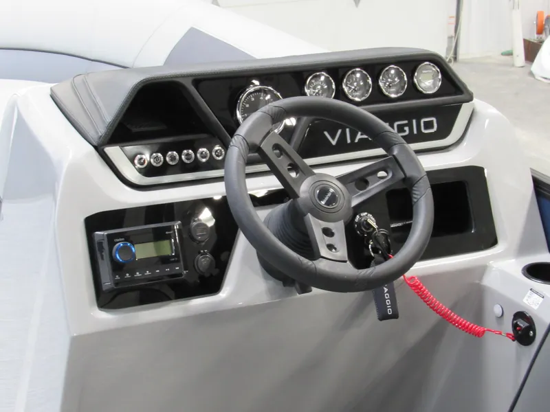Slide: The Image of 2025 Viaggio Lago V20U boat dashboard with steering wheel and control panel. - 5
