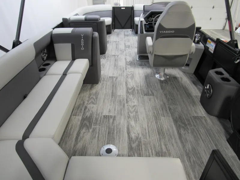 Slide: The Image of 2025 Viaggio Lago X22C boat interior with gray seating and modern design. - 3