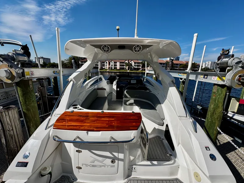 The Image of 2024 NX Boats 280 Xtreme luxury yacht docked, showcasing sleek design and spacious interior. - 0