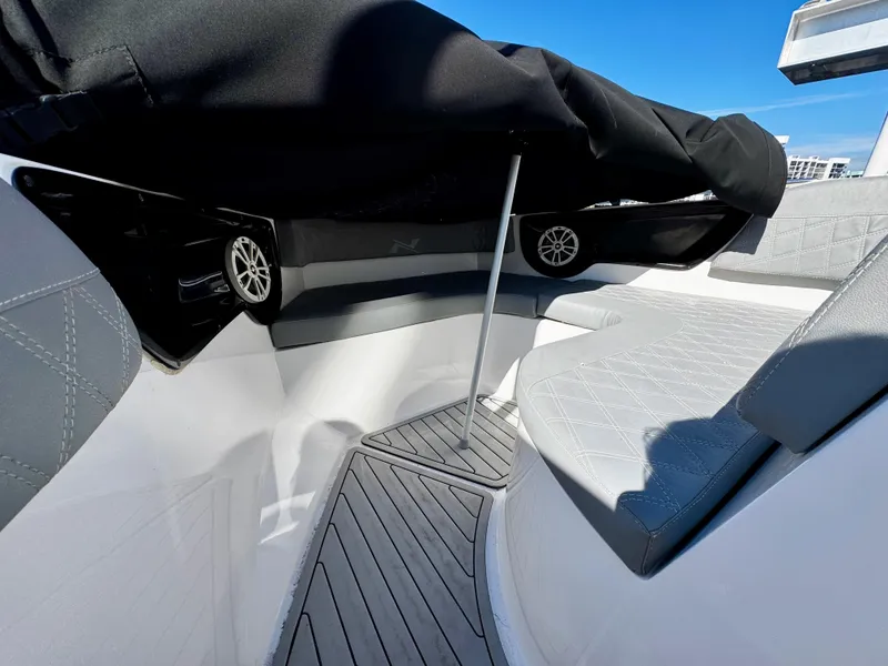Slide: The Image of 2024 NX Boats 280 Xtreme interior with sleek seating and modern design. - 19