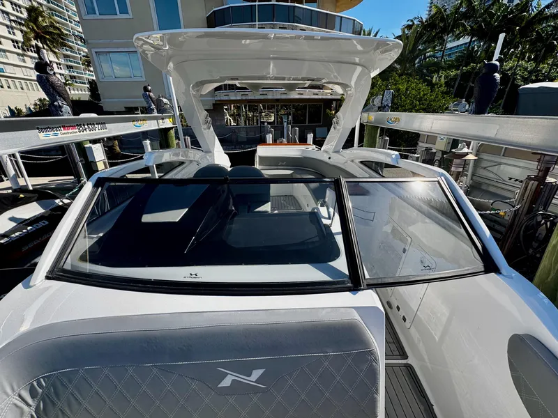 Slide: The Image of 2024 NX Boats 280 Xtreme docked, showcasing sleek design and modern features. - 21