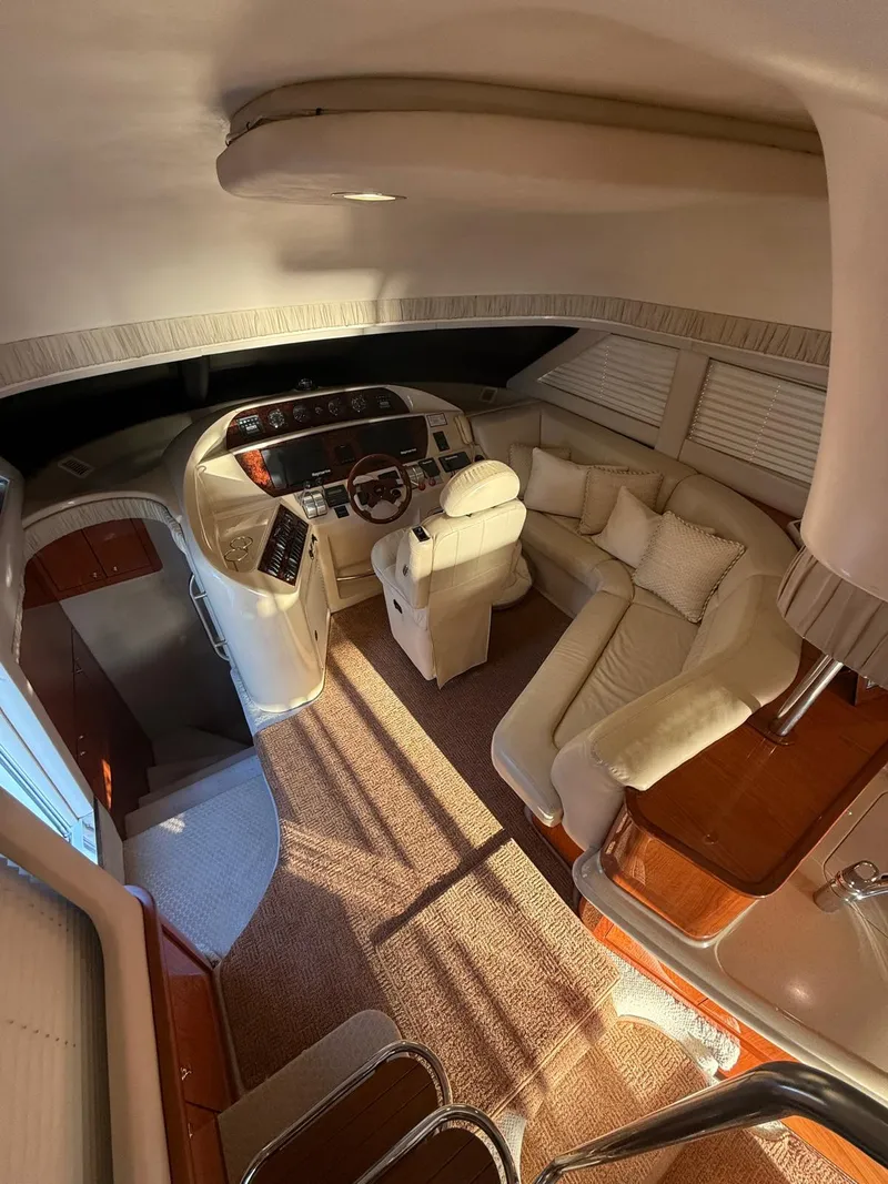 Slide: The Image of Interior of 2001 Sea Ray 540 Cockpit Motor Yacht with plush seating and helm. - 10