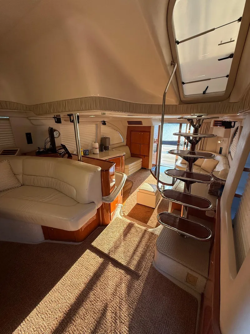 Slide: The Image of Interior of 2001 Sea Ray 540 Cockpit Motor Yacht with elegant seating and staircase. - 11
