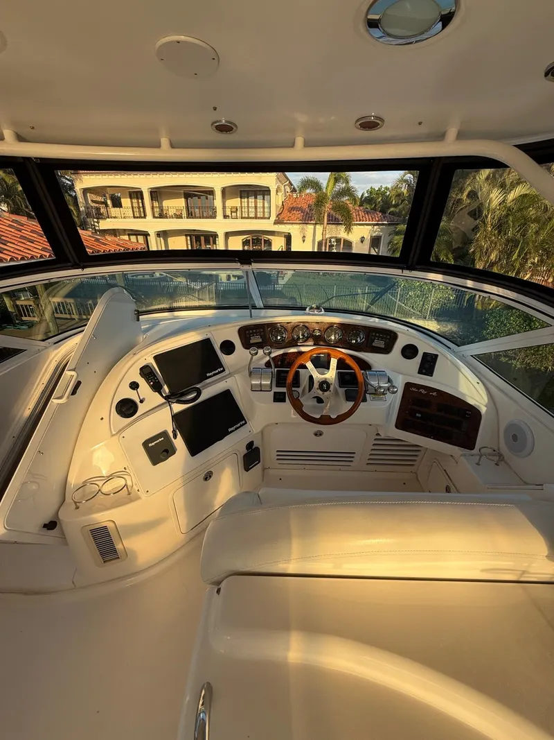 Slide: The Image of 2001 Sea Ray 540 Cockpit Motor Yacht helm with modern controls and panoramic view. - 14