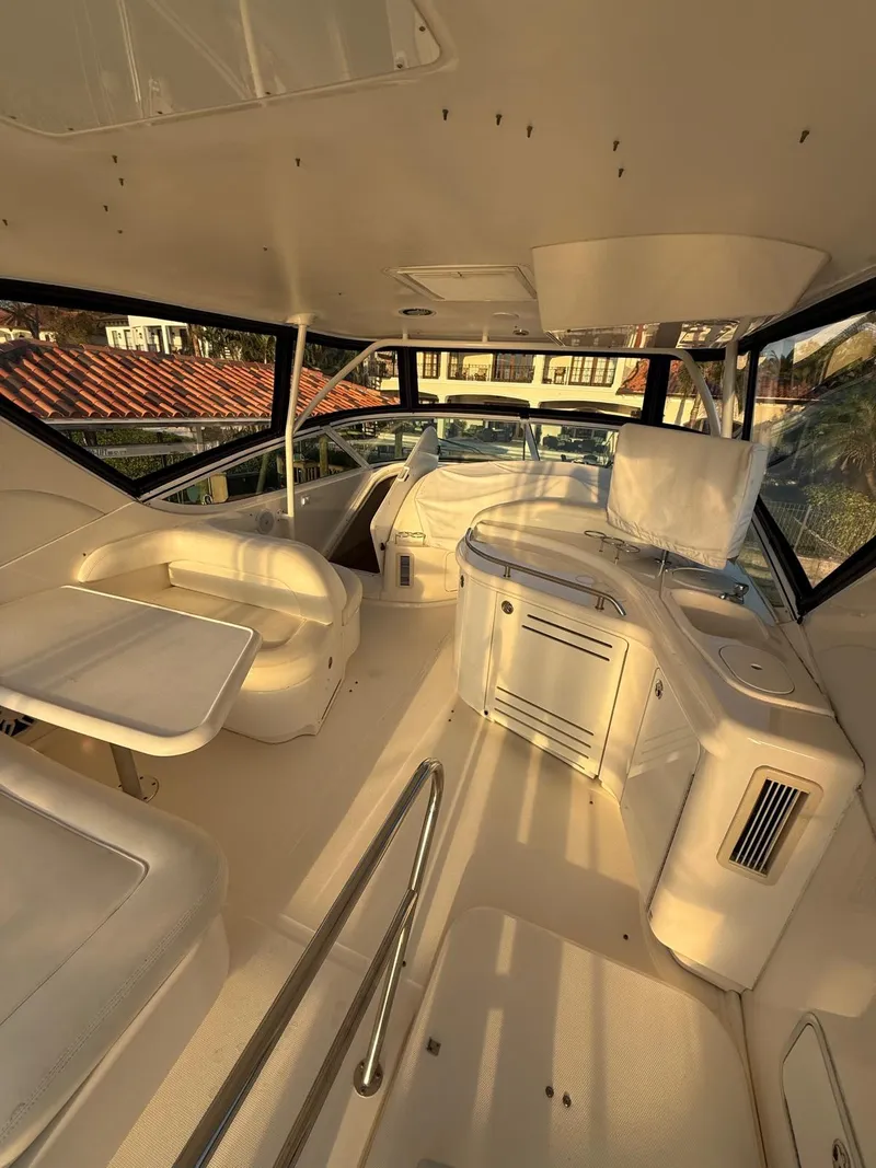 Slide: The Image of 2001 Sea Ray 540 Cockpit Motor Yacht interior with seating and helm station. - 18