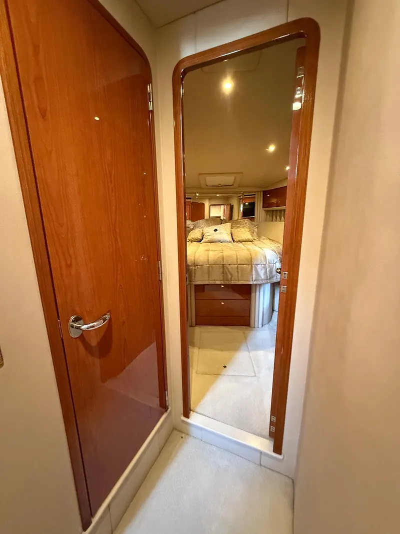 Slide: The Image of Interior hallway of 2001 Sea Ray 540 Cockpit Motor Yacht with mirror and wooden door. - 20