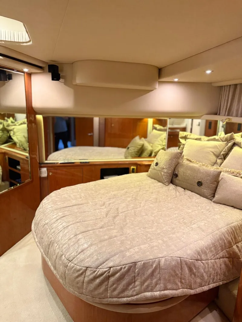 Slide: The Image of Luxurious bedroom interior of 2001 Sea Ray 540 Cockpit Motor Yacht with plush bedding. - 22