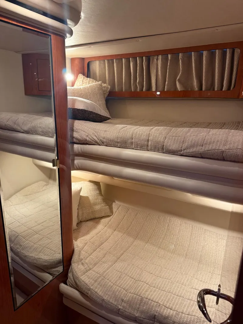Slide: The Image of Interior cabin of 2001 Sea Ray 540 Cockpit Motor Yacht with bunk beds. - 23