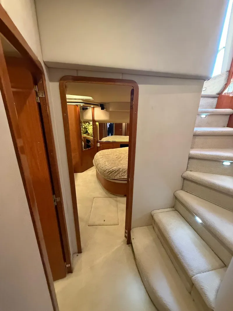 Slide: The Image of Interior of 2001 Sea Ray 540 Cockpit Motor Yacht with carpeted stairs and cozy cabin. - 25