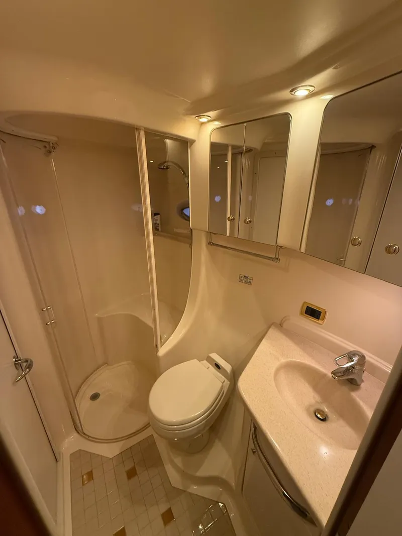 Slide: The Image of 2001 Sea Ray 540 Cockpit Motor Yacht bathroom with shower, sink, and toilet. - 27