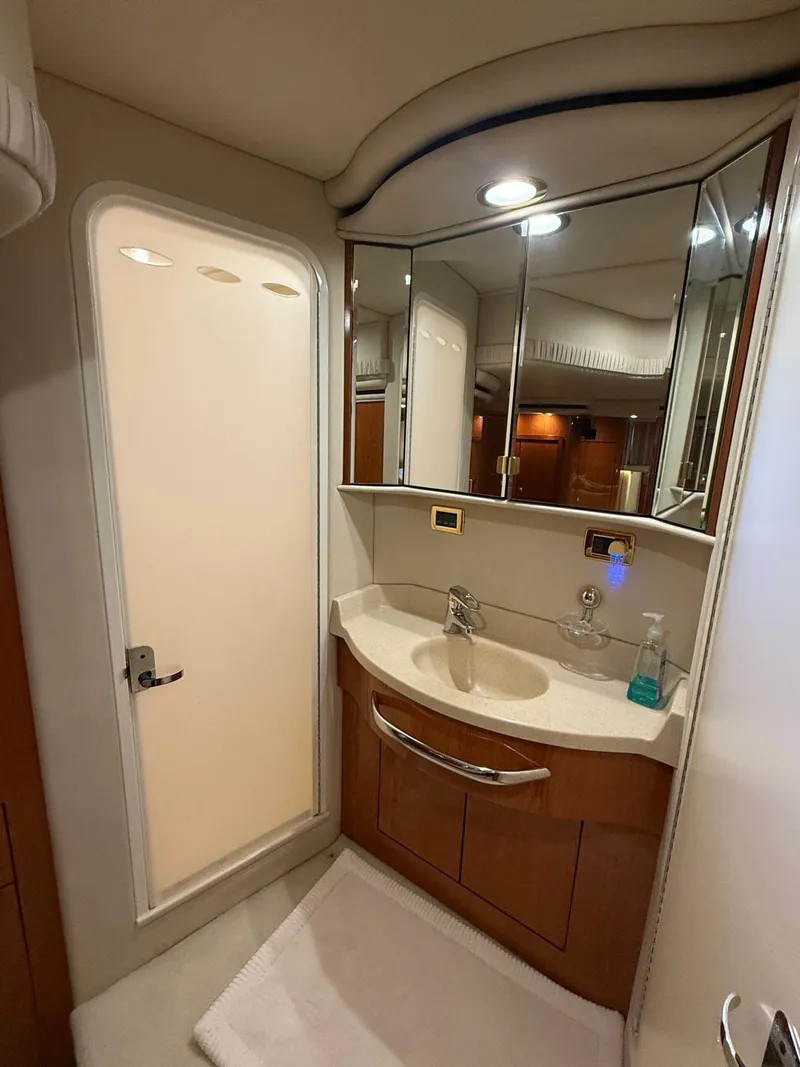 Slide: The Image of Bathroom interior of 2001 Sea Ray 540 Cockpit Motor Yacht, featuring modern fixtures and cabinetry. - 29