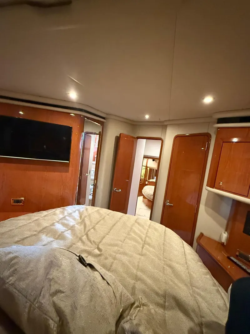Slide: The Image of Interior of 2001 Sea Ray 540 Cockpit Motor Yacht with cozy bedroom and modern amenities. - 32