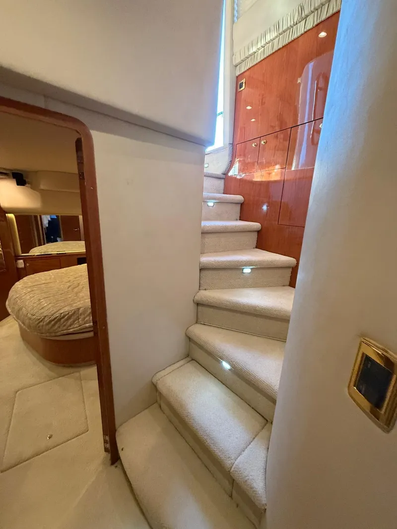 Slide: The Image of Interior of 2001 Sea Ray 540 Cockpit Motor Yacht with carpeted stairs and cozy bedroom. - 33