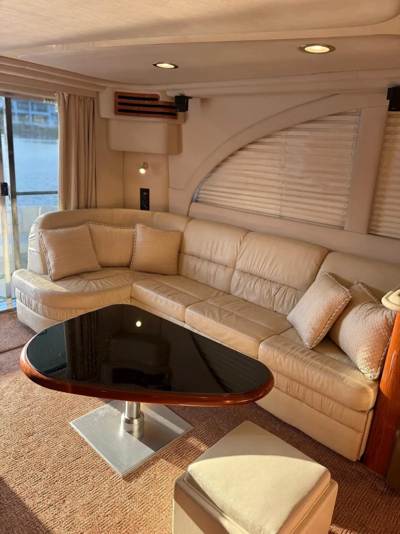 Slide: The Image of Luxurious interior of 2001 Sea Ray 540 Cockpit Motor Yacht with plush seating and elegant table. - 6