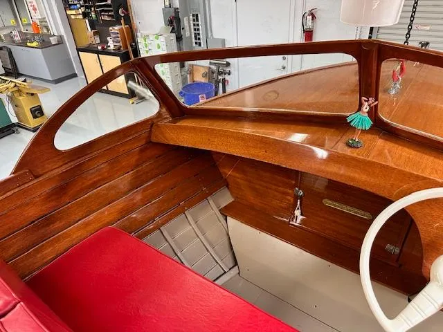 Slide: The Image of 1956 Custom South Coast Boatyard interior with red seating and wooden dashboard. - 3