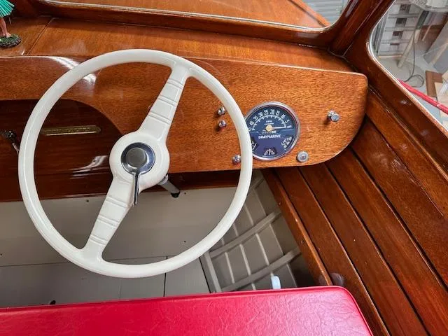 Slide: The Image of Vintage 1956 South Coast Boatyard steering wheel and dashboard with wooden finish. - 4