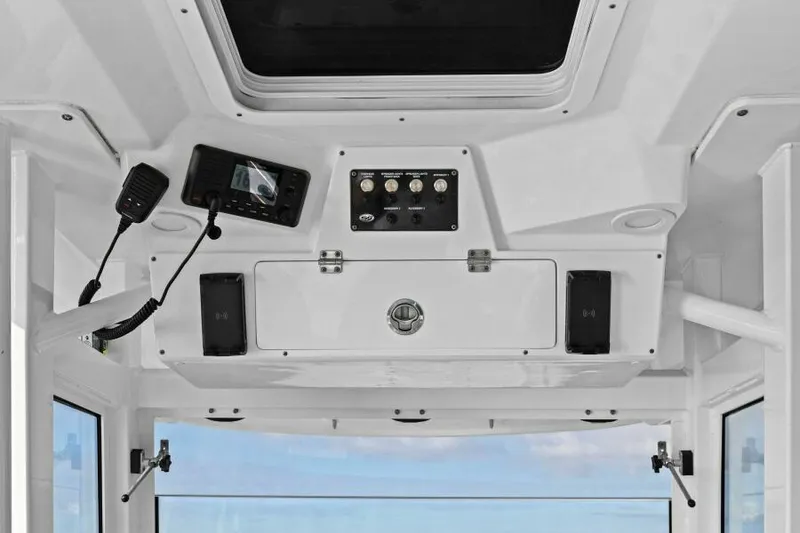 Slide: The Image of 2024 Sea Fox 328 Commander boat console with controls and communication equipment. - 14