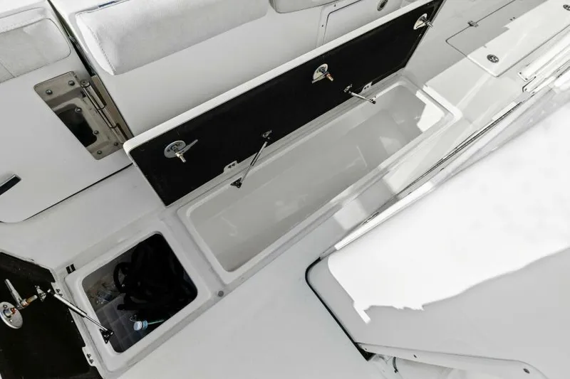 Slide: The Image of 2024 Sea Fox 328 Commander storage compartments and seating area. - 18