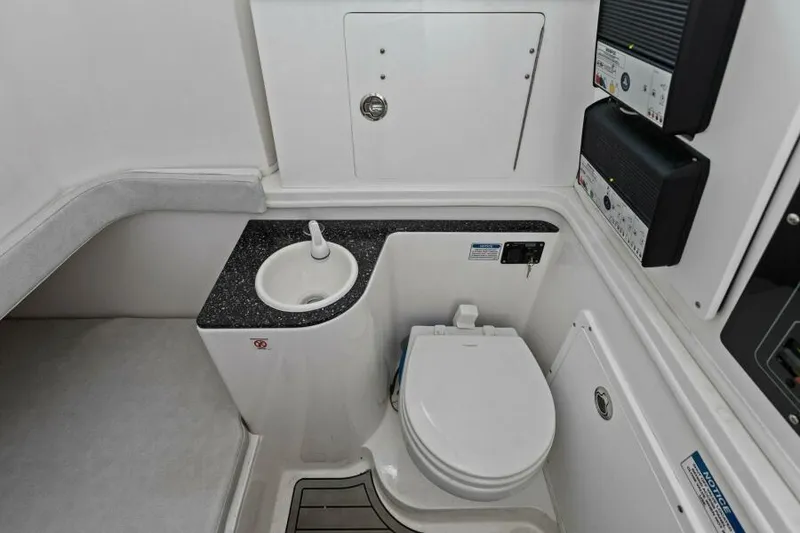 Slide: The Image of 2024 Sea Fox 328 Commander boat bathroom interior with sink and toilet. - 27