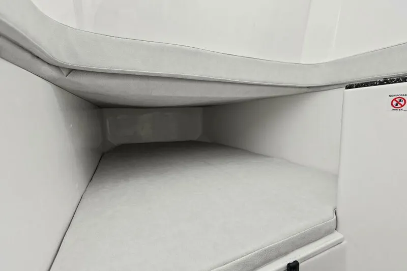 Slide: The Image of 2024 Sea Fox 328 Commander interior cabin with cushioned seating. - 29