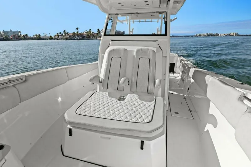 Slide: The Image of 2024 Sea Fox 328 Commander boat interior with seating, ocean view. - 3