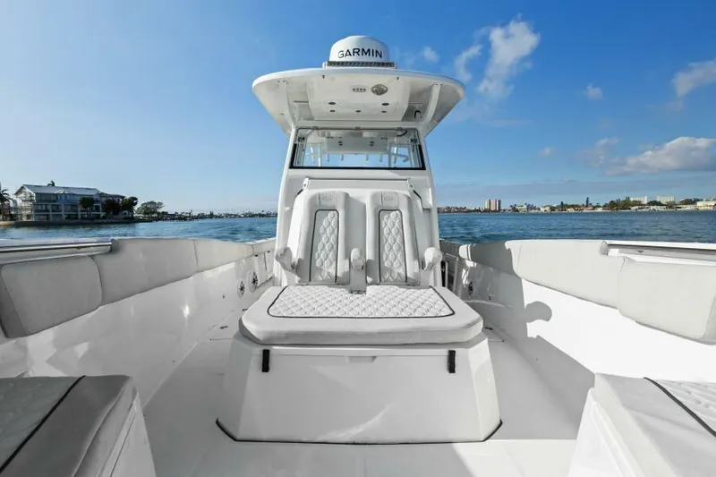 Slide: The Image of 2024 Sea Fox 328 Commander boat interior with seating, on a sunny day. - 30