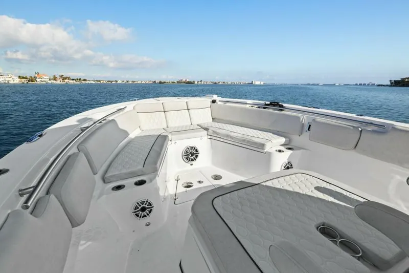 Slide: The Image of 2024 Sea Fox 328 Commander boat interior with seating, on a calm ocean. - 31