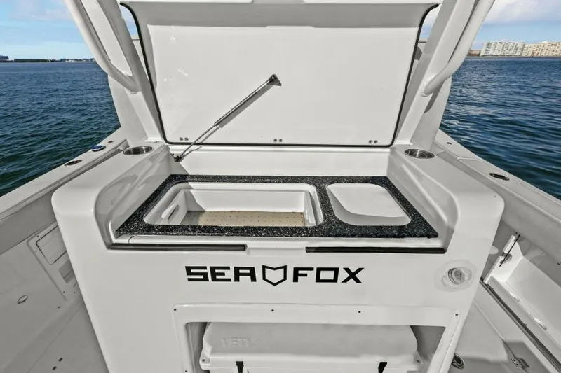 Slide: The Image of 2024 Sea Fox 328 Commander boat interior with open storage compartment. - 34