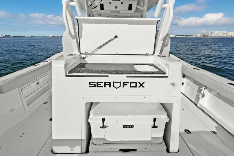 Slide: The Image of 2024 Sea Fox 328 Commander boat deck with Yeti cooler, ocean view. - 35