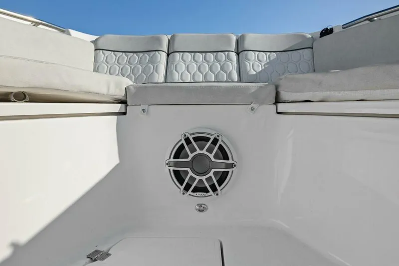 Slide: The Image of 2024 Sea Fox 328 Commander boat interior with cushioned seating and speaker. - 37
